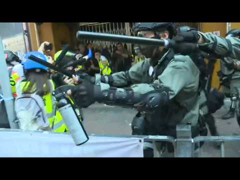 Hong Kong police fire pepper spray amid flashmobs