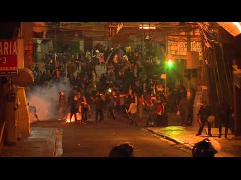 Police and Morales supporters clash in La Paz as new leader endorsed