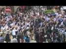 Office workers in HK's business district show solidarity to protest movement