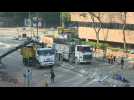 Excavators start clearing debris as diehards hold out at HK campus