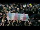 Mourners carry Soleimani's coffin during a ceremony in Tehran