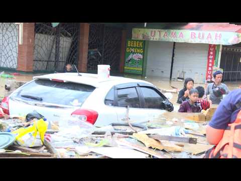 Indonesia floods leave two dozen dead, several missing