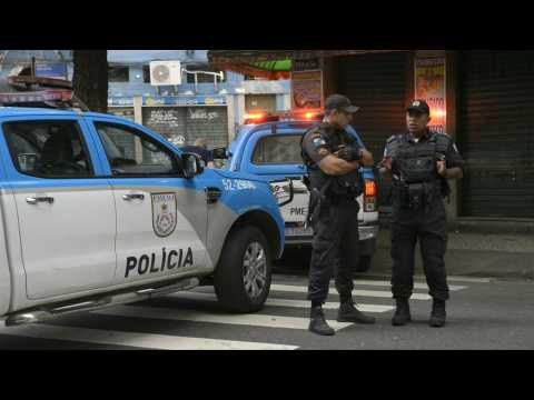 Police patrol area near Rio's bar where man is holding four hostages