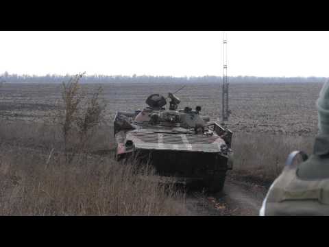 Ukraine foes begin key troop pullback in war-torn east
