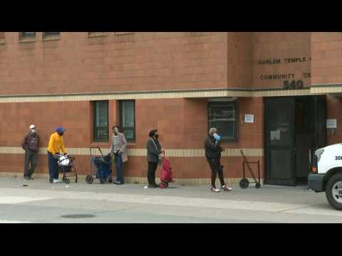 People line up for food handouts in New York