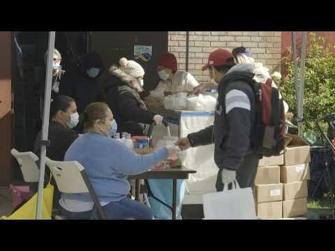 Volunteers distribute food in New York as unemployment worsens in US
