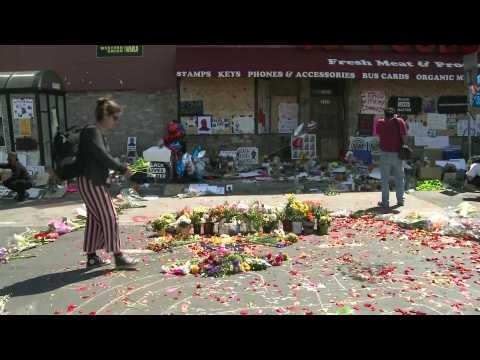 People pay tribute at site of George Floyd's arrest in Minneapolis