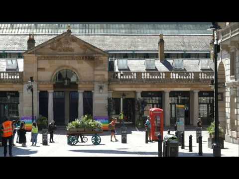 Queues at London's Covent Garden as shops reopen