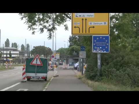 Vehicles cross French-German border as it reopens