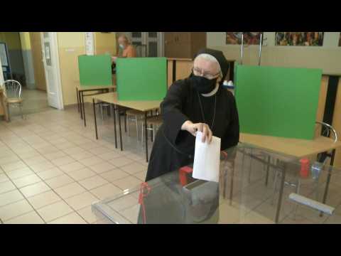 Poland begins voting in election delayed by virus
