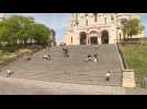 Parisians brave police fine to soak up sunshine at the Sacré-Cœur