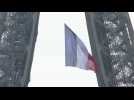 Large French flag hangs from Eiffel Tower to mark 75 years since end of World War II