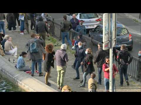 Police break up the crowds as Parisians flock to Canal Saint-Martin