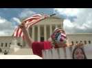 Pro-immigration activists gather outside Supreme Court after it blocked Trump from ending DACA