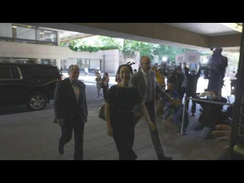Images of Huawei executive arriving at court ahead of ruling