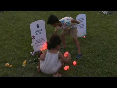 Americans attend vigil at George Floyd's makeshift memorial in Minneapolis