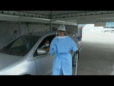 Brazilians get tested for COVID-19 at drive-through testing site