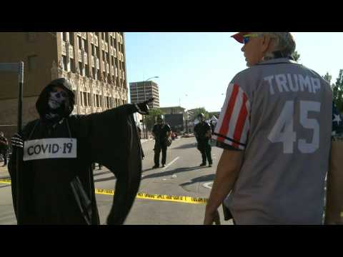 Protesters pro and anti-Trump gather outside rally venue in Tulsa