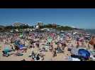 Thousands flock to English beach town as heatwave hits restriction-weary Europe