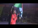 Sudanese protesters gather outside the army's HQ at night