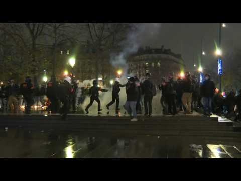 Violence erupts in new Paris protest against security law (2)
