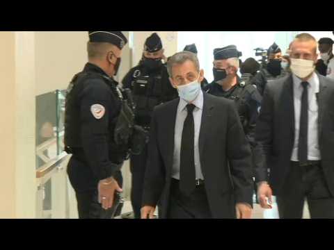 Former French president Nicolas Sarkozy arrives at court as his landmark graft trial continues