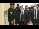 Former French president Nicolas Sarkozy arrives at court as his landmark graft trial continues
