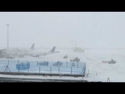 US: Workers plow snow at Boston airport amid East Cost winter storm