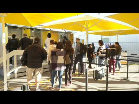 People line up at Los Angeles airport rapid testing site