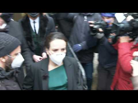 Assange's fiancee and WikiLeaks' editor-in-chief leave court after extradition hearing