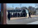Beijing residents line up to board buses heading to Covid vaccination sites