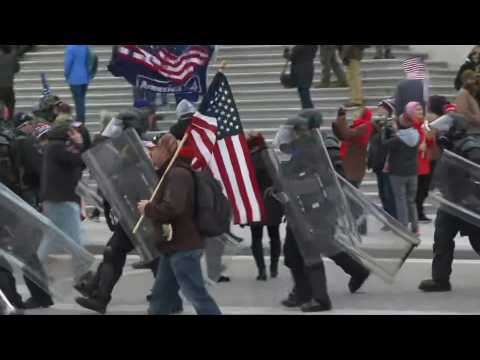 Riot police arrive after Trump supporters storm the US Capitol