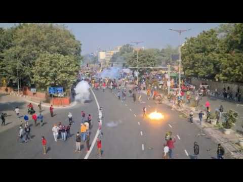 Tear gas fired at Indian tractor rally as farmers march to central Delhi