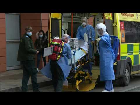 Covid patient arrives at London hospital as UK records over 100,000 deaths