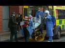 Covid patient arrives at London hospital as UK records over 100,000 deaths