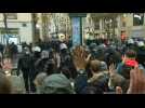 Riot police charge to try to push back Paris security law protesters