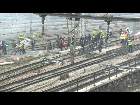 Striking railway workers protest on Paris train tracks