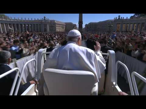 Pope greets thousands gathered in St Peter's Square as he leaves Easter Mass