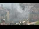 Excavator on site of Marseille building collapse as smoke rises