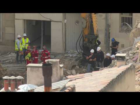 Investigators at the site of building collapse in Marseille