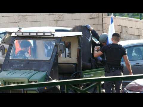 Israeli security forces remove remains of rocket fired from Gaza Strip