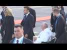Pope Francis with Emmanuel and Brigitte Macron at the airport