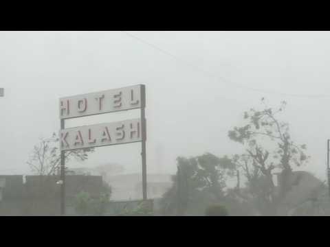 Powerful winds and rain as Cyclone Biparjoy batters India's coast