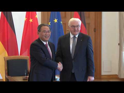 Chinese Premier Li Qiang signs guestbook, shakes hands with German President Steinmeier