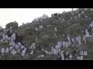 Pilgrims stand at top of Mount Arafat for hajj climax