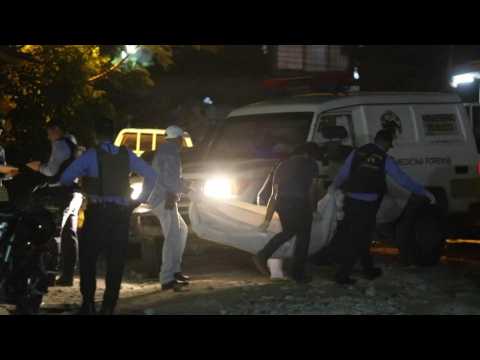 Investigators, police at the scene of suspected gang-related shooting leaving 11 dead