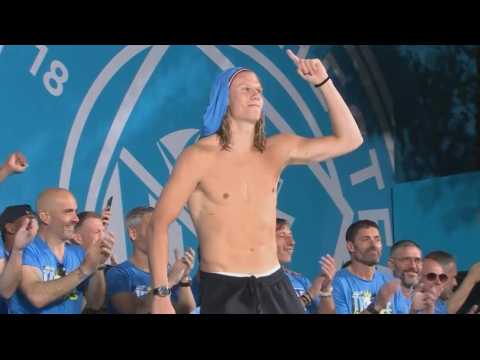 City players celebrate treble on stage in Manchester