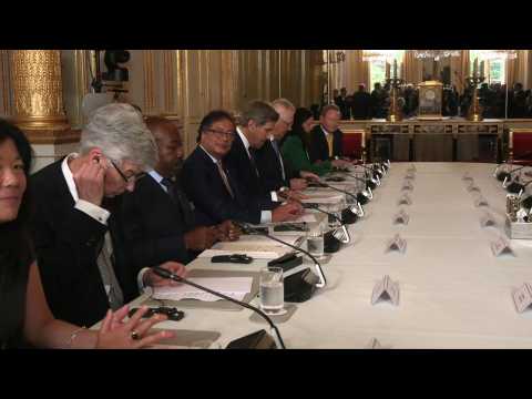 Macron hosts "coalition of champions" to finance fight against climate change