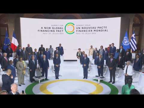 Macron arrives for family photo at end of climate summit in Paris