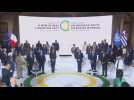Macron arrives for family photo at end of climate summit in Paris